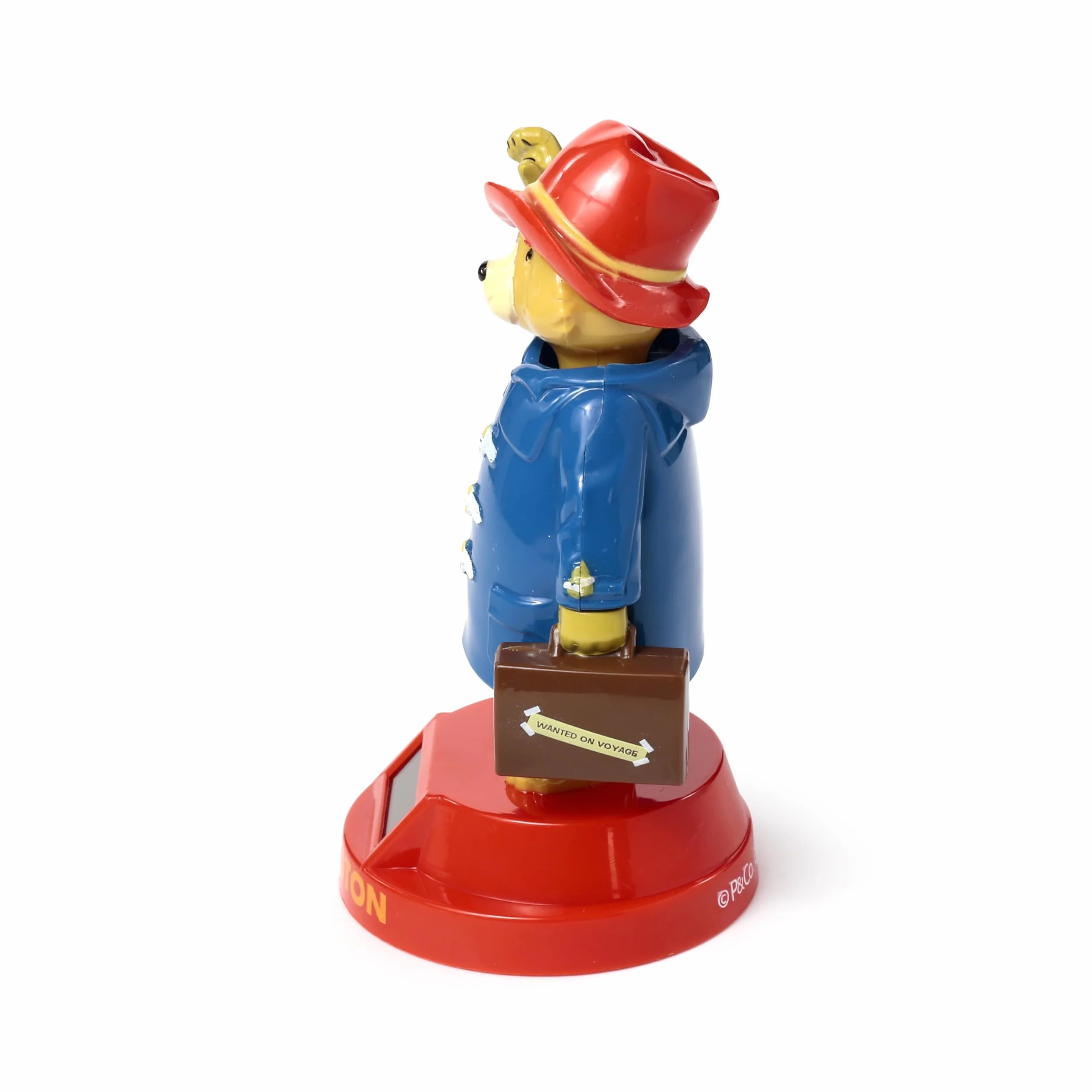 Paddington nied?wied? solarna figurka ko?ysz?ca si?, niebieski p?aszcz, czerwona podstawa