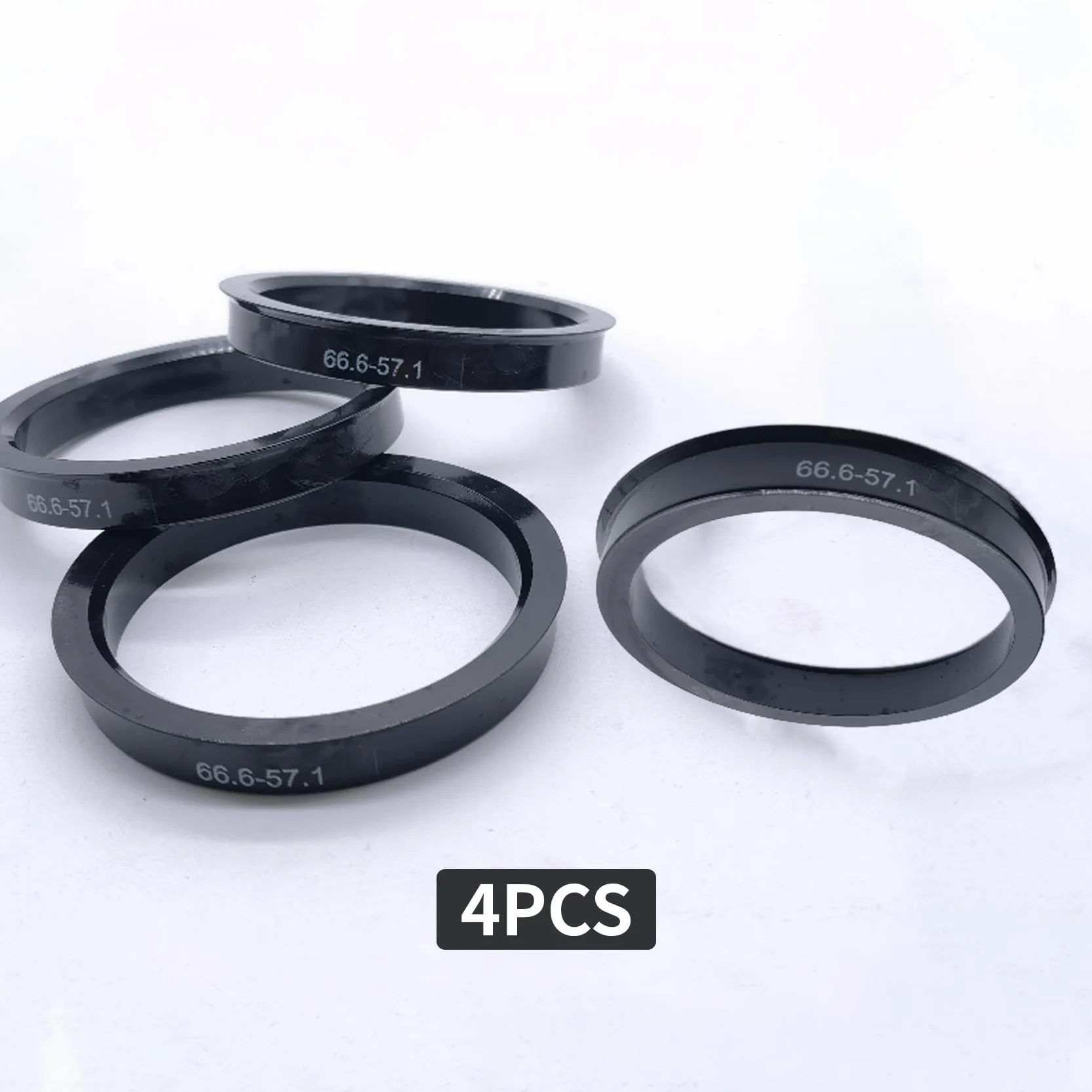 Pierścienie centrujące 66,6 mm na 57,1 mm do VW Mercedes Audi, tworzywo sztuczne czarne (4 sztuki)