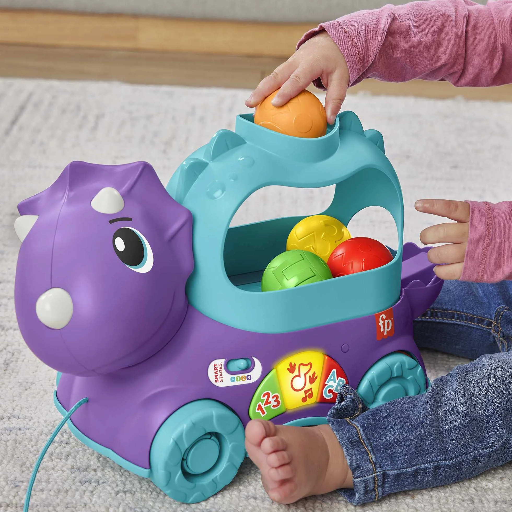 Fisher-Price Dinuś Podskakujące piłeczki Edukacyjna zabawka do ciągnięcia dla niemowląt i starszych dzieci, z treściami Poziomy nauki z możliwością wyboru języka, HNR51