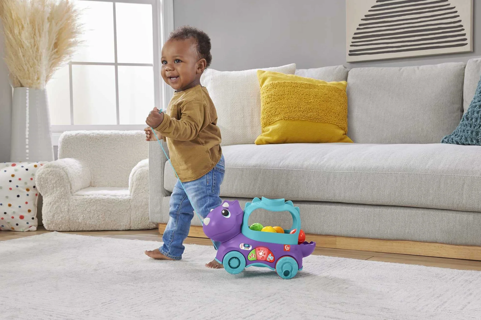 Fisher-Price Dinuś Podskakujące piłeczki Edukacyjna zabawka do ciągnięcia dla niemowląt i starszych dzieci, z treściami Poziomy nauki z możliwością wyboru języka, HNR51
