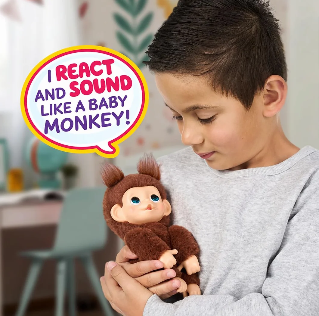Little Live Pets Baby Monkey Minis – Chikki Cherry. Interaktywna zabawka dla zwierząt domowych. Ponad 20 dźwięków i reakcji. Miękkie brązowe futro. 18,8 cm wysokości. Super realistyczny. Karmić